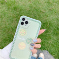 Green TPU iPhone case with geometric smiley face and polka dot design on a simple back cover.