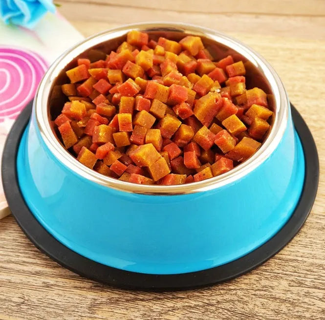 Stainless steel pet bowl inside a colourful melamine bowl, showing non-slip rubber base, in orange colour.