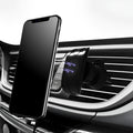 Matte black car phone holder clipped to air vent with adjustable side arms for smartphones