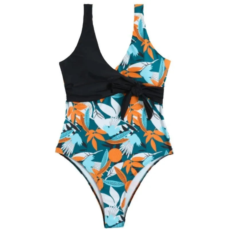 Women's high-waist one-piece swimsuit in a printed pattern, showing conservative cut and style.