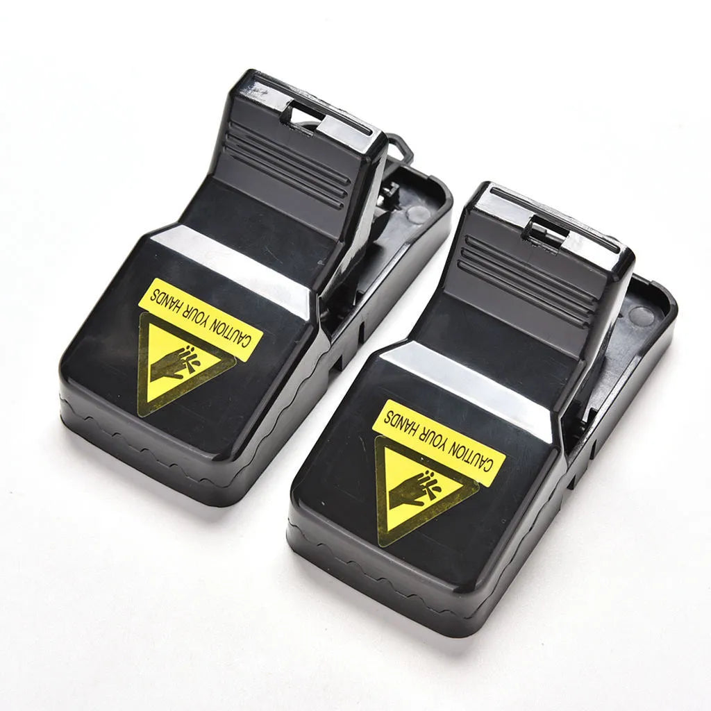 Six black snapping mousetraps made from alloy plastic with dimensions 11cm by 5cm