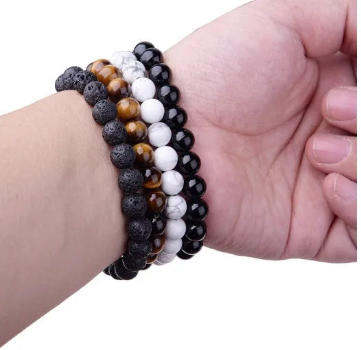 Geometric black agate bracelet with 8mm beads on a black elastic cord for women.