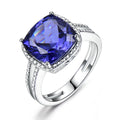 Close-up of a blue Tanzanite stone set in a polished 925 Sterling Silver women's ring.