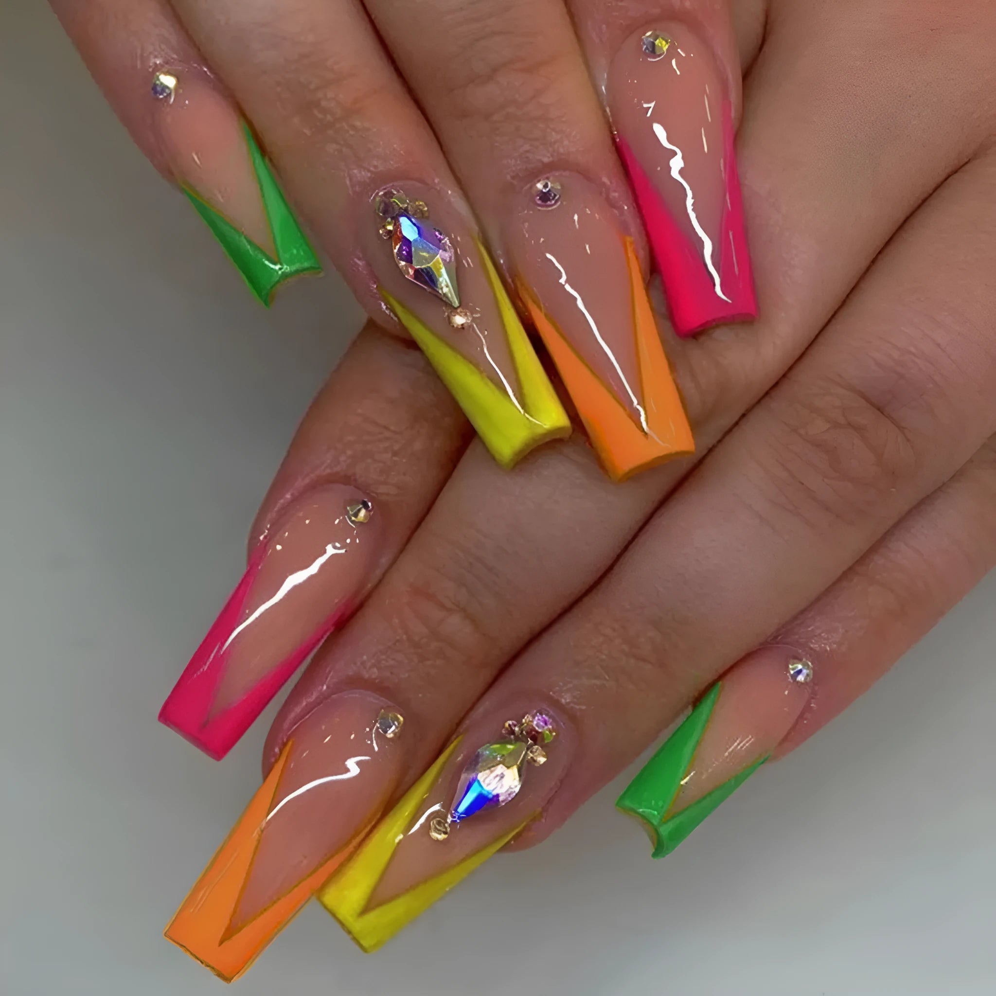 Diamond colour French style artificial nail tips with red cartoon love heart and cross designs.