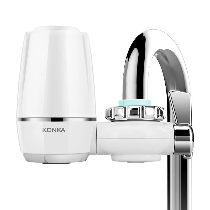 White faucet-mounted water purifier with ceramic filter and adapter kit for kitchen tap installation.