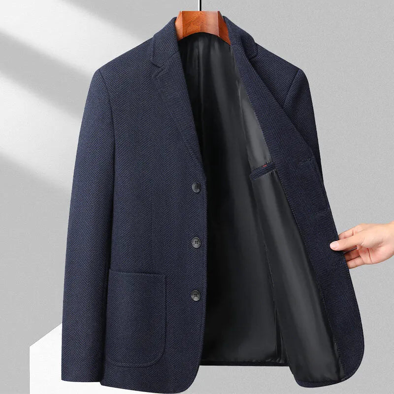 Man wearing a loose fit black woolen coat for casual spring or autumn leisure wear.