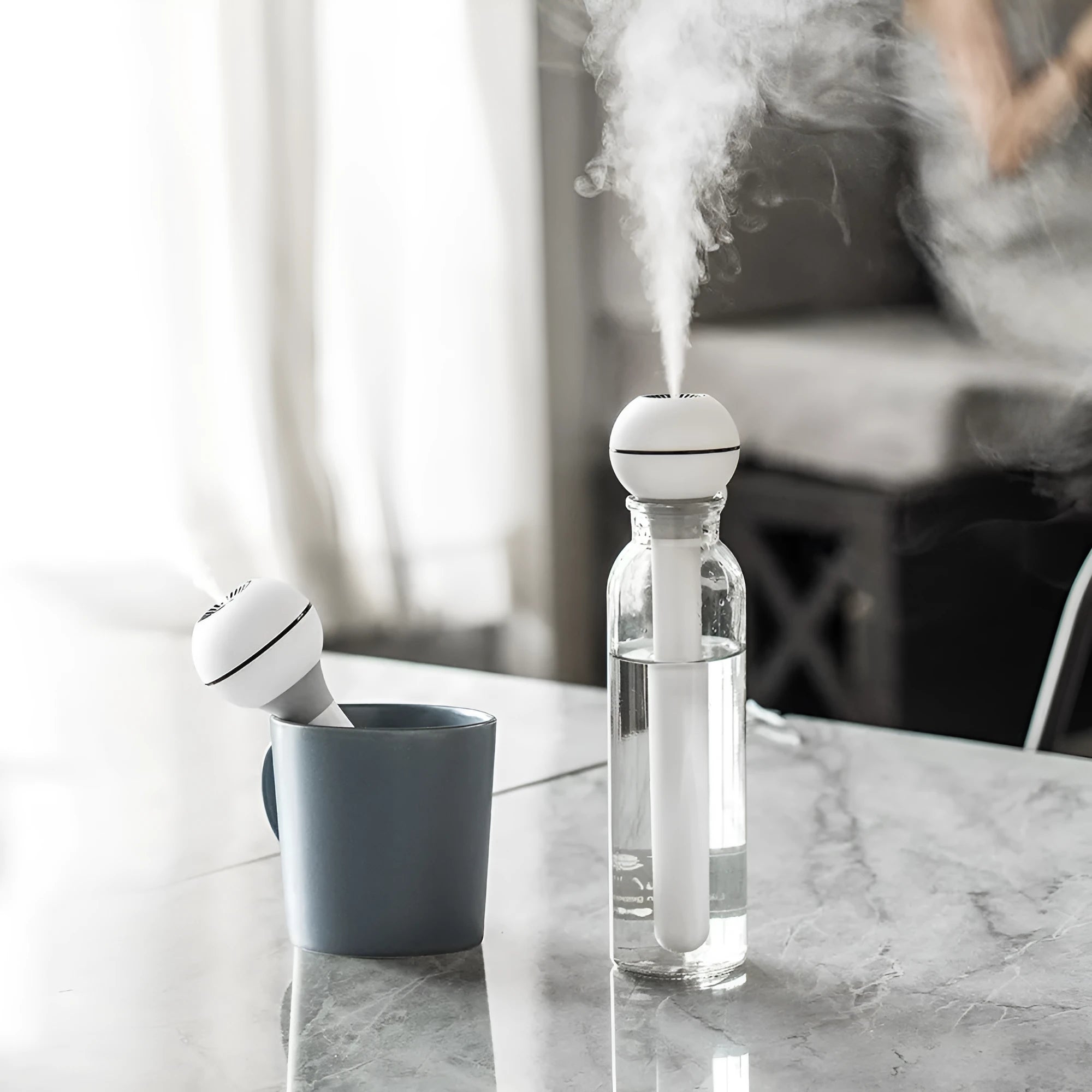 Pink and white columnar ultrasonic humidifier with USB cable and water tank
