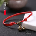 Nylon rope dog collar with a brass bell, shown in black colour, designed for small dogs.
