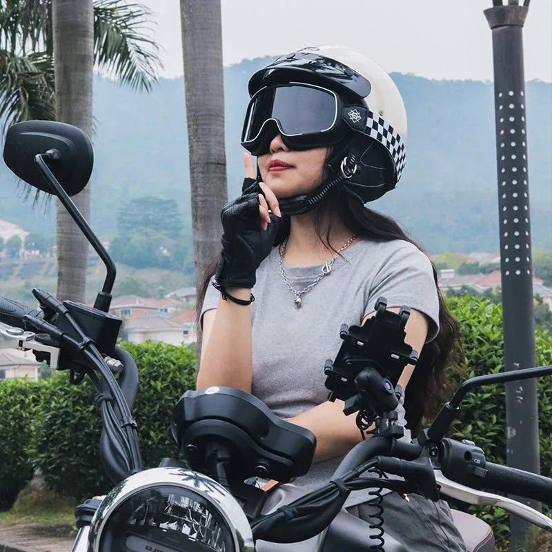 Retro style motorcycle helmet shown in cement grey colour on a solid background