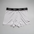 Men's loose fit silk shorts in navy blue on a neutral background