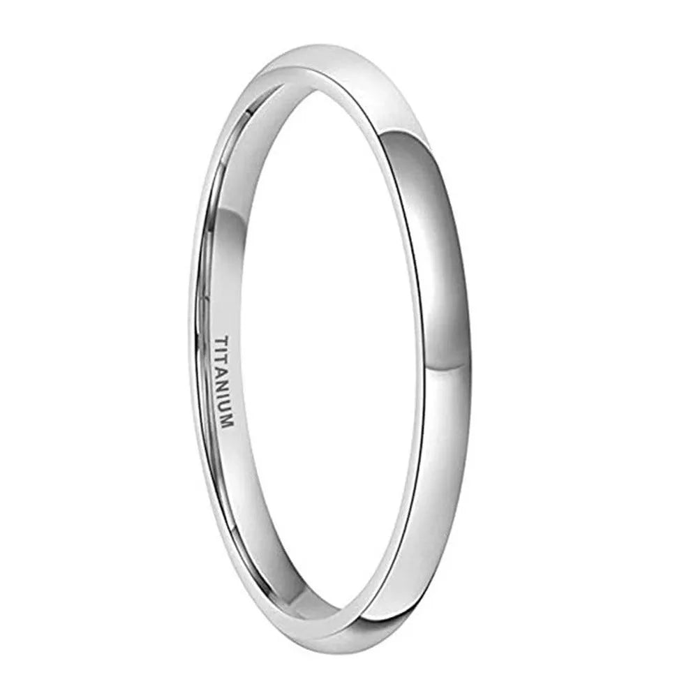 Silver titanium steel ring on a plain background showing its simple band design and grinding finish