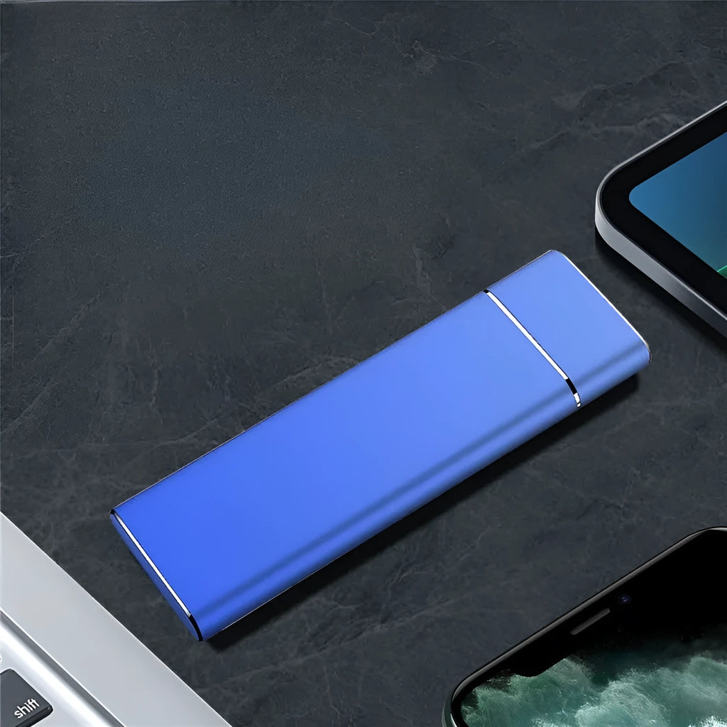 Sapphire blue metal portable solid state external hard drive with USB cable on a white background.