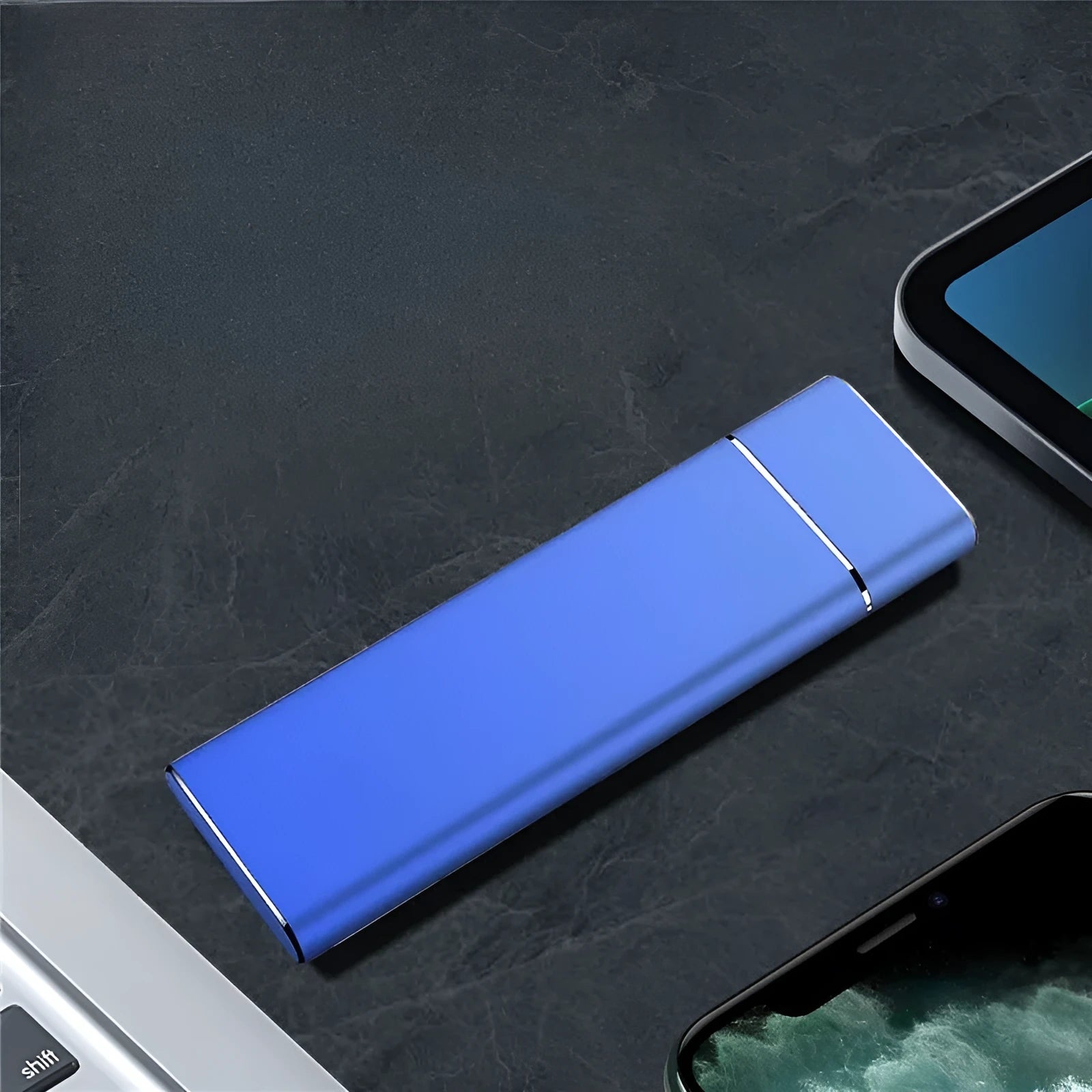 Sapphire blue metal portable solid state external hard drive with USB cable on a white background.