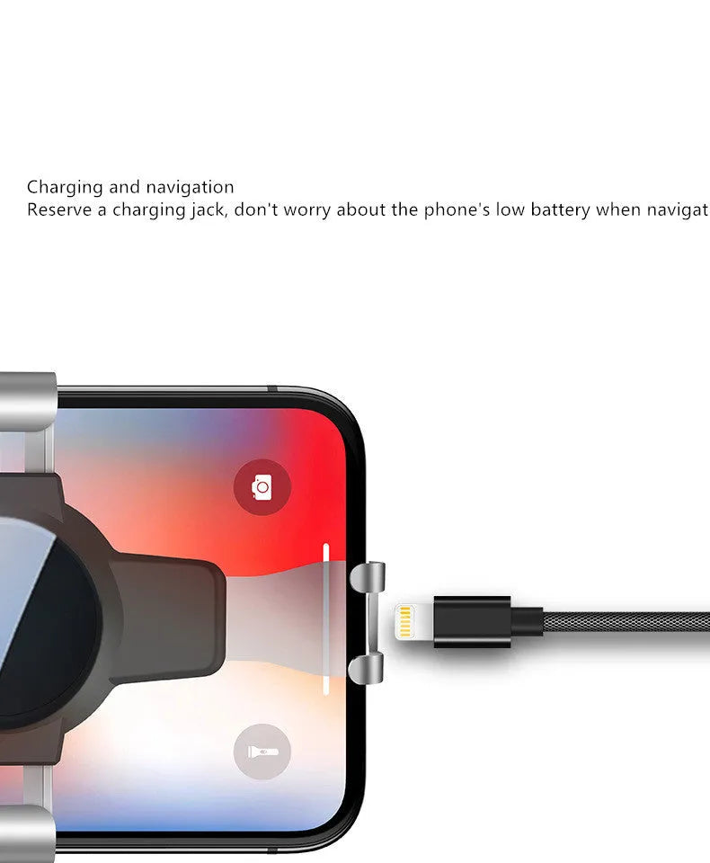 Black S4 gravity mirror ABS phone bracket clipped to a car air vent, holding a mobile phone.