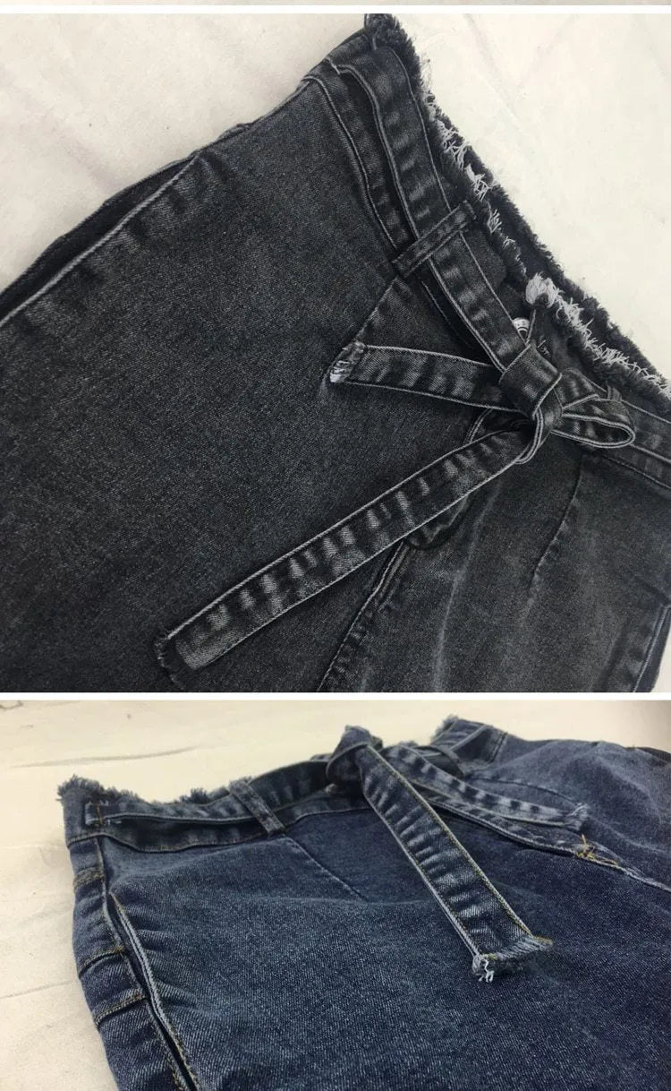 Fringed jeans in stretch cowboy denim with distressed hem detailing in dark blue colour