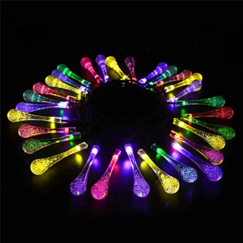 6.5 metre solar LED fairy lights with 30 warm white bulbs and bubble drop pendant design