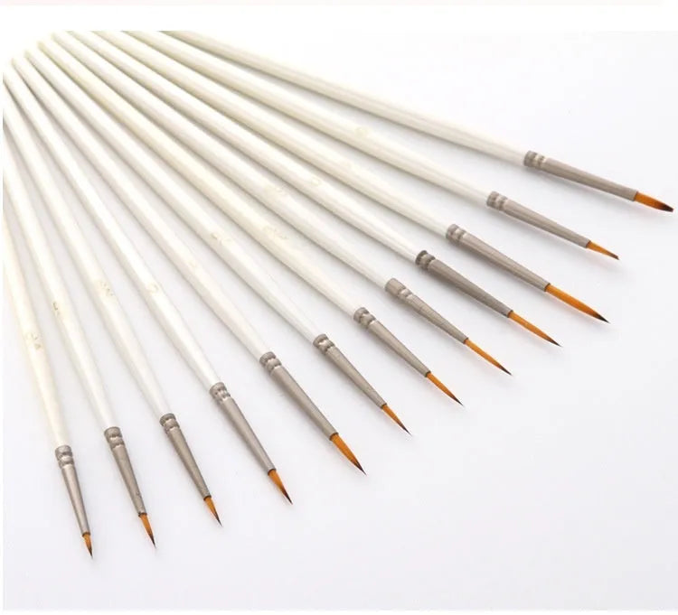 12 Pearl White artist brushes with nylon wool bristles and solid wood handles arranged by size.
