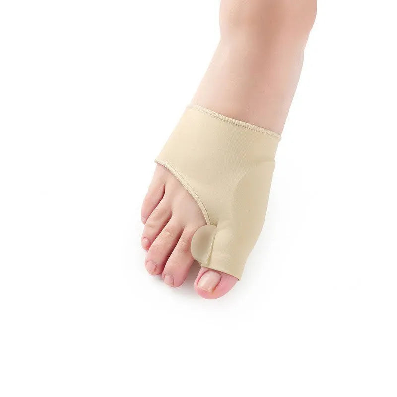 Corrective bunion relief sock with gel pad and silicone toe separator on a foot.