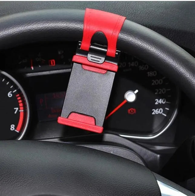 Black steering wheel phone clip mount holder showing adjustable clip and phone placement