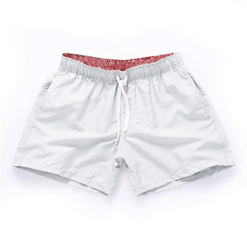 Men's polyester beach shorts in multiple colours with straight leg opening, suitable for surfing and swimming