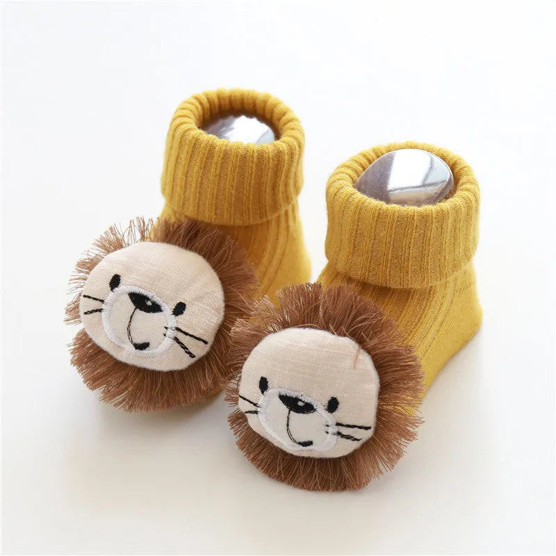 Cotton baby floor socks in various designs including blue bow and lion, showing sizes for infants 0-3 months