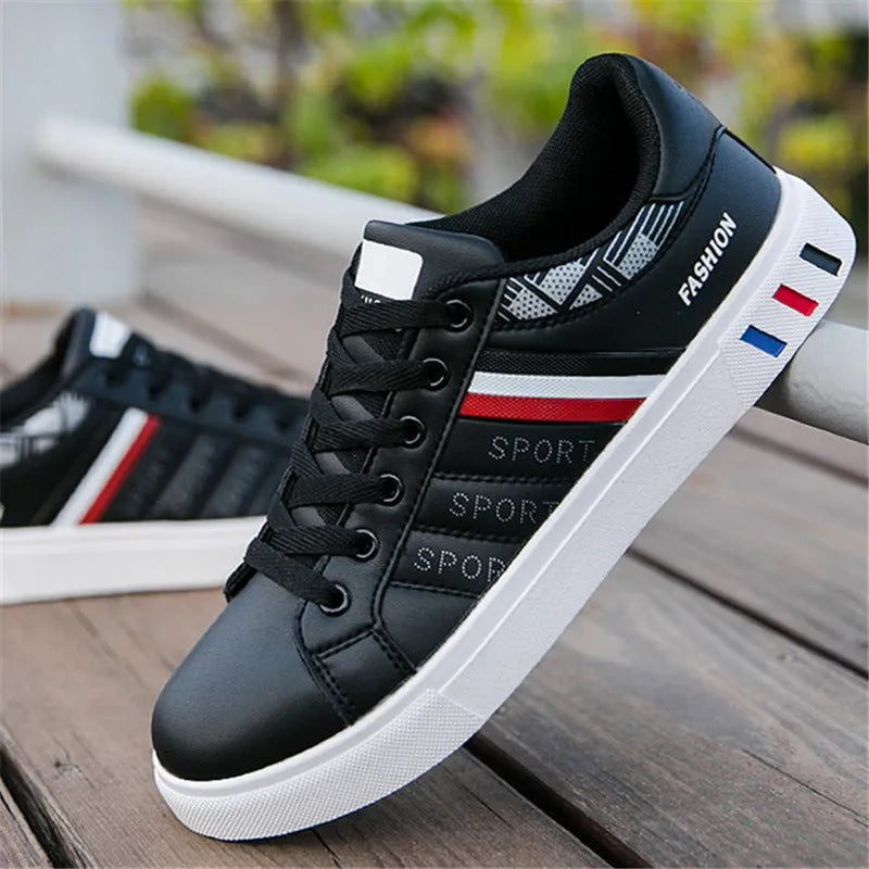 A pair of standard sports shoes shown in a choice of black, grey, or white colour.
