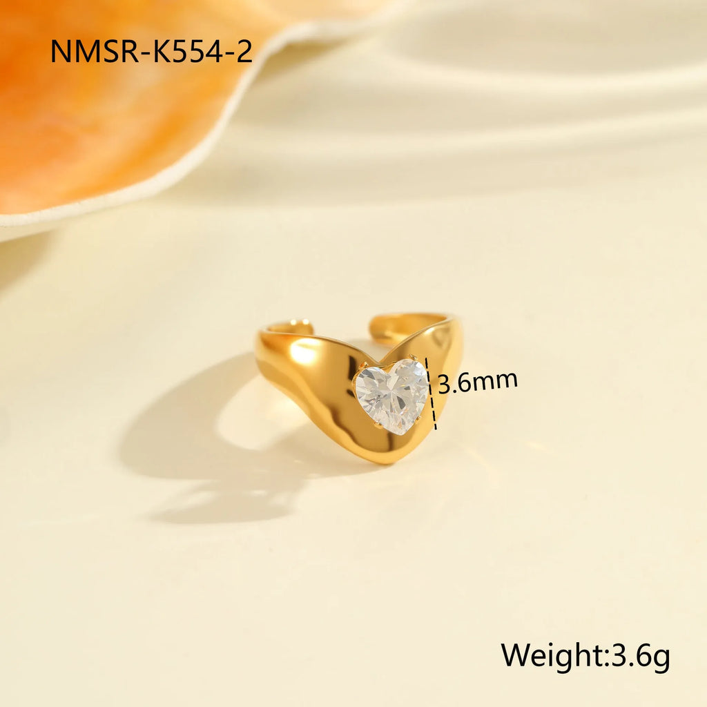 Geometric zircon ring with stainless steel construction and open mouth design in electroplated finish