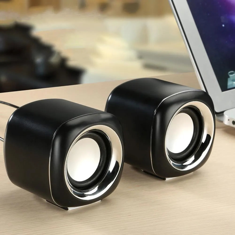 Pair of mini wired computer speakers with volume scroll wheel in black or white colour