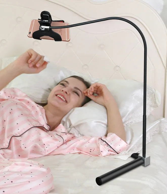 Black mobile phone bed bracket with adjustable universal holder mounted on bed frame