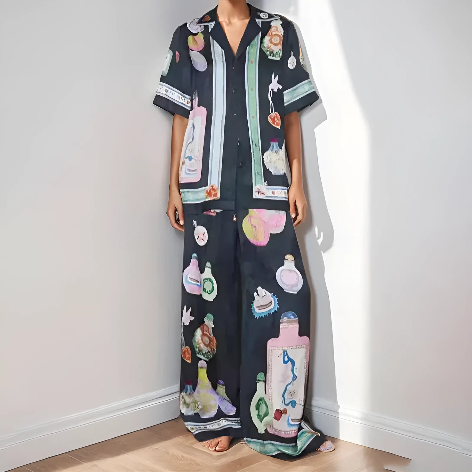 Black two-piece cardigan and pants set with cartoon animation pattern for women