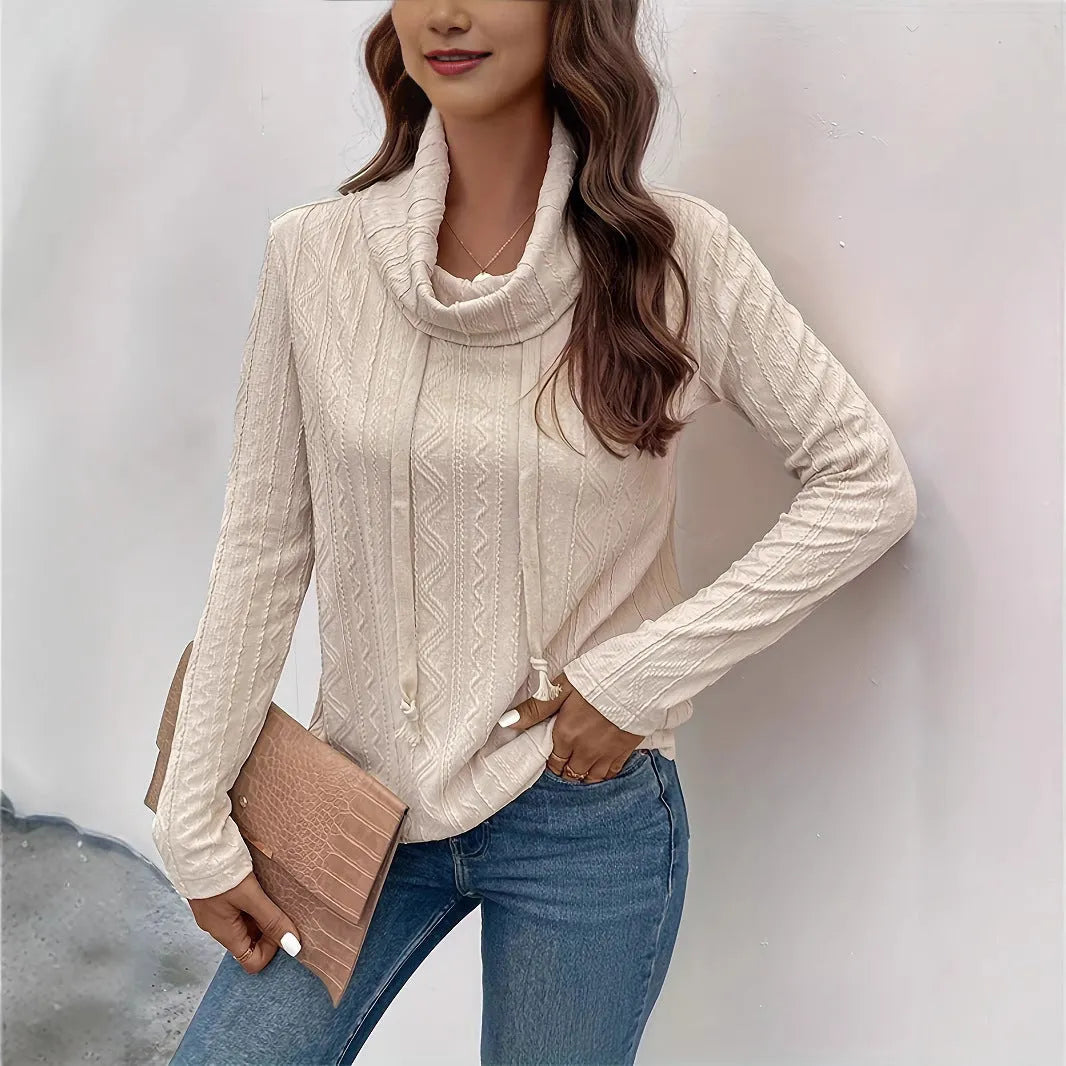 Apricot coloured long sleeve hooded pullover sweater with a drawstring