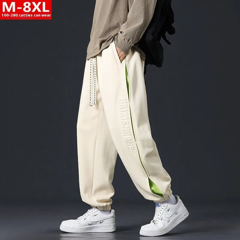 Men's loose cotton trousers with stitching printing design and ankle banded cuffs in black colour