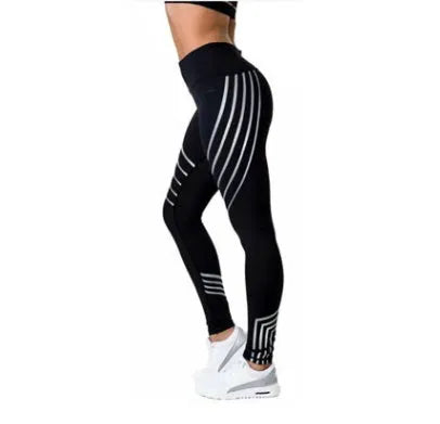Women's black printed Milk Silk workout leggings with a slim fit, shown from the side.
