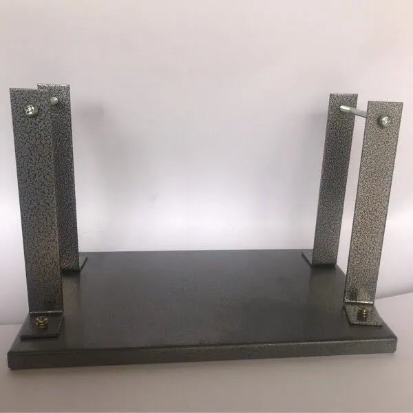 Black iron flip chip bracket for holding a portable electric planer inverted.