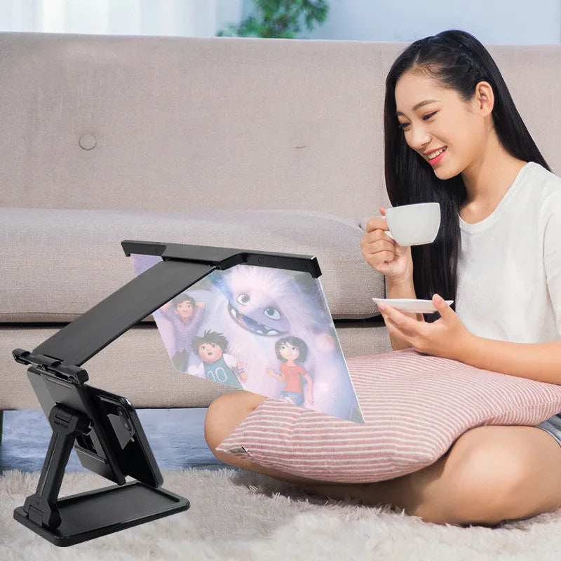 Black L20 split mobile phone screen magnifier with 12-inch acrylic lens and folding bracket on table