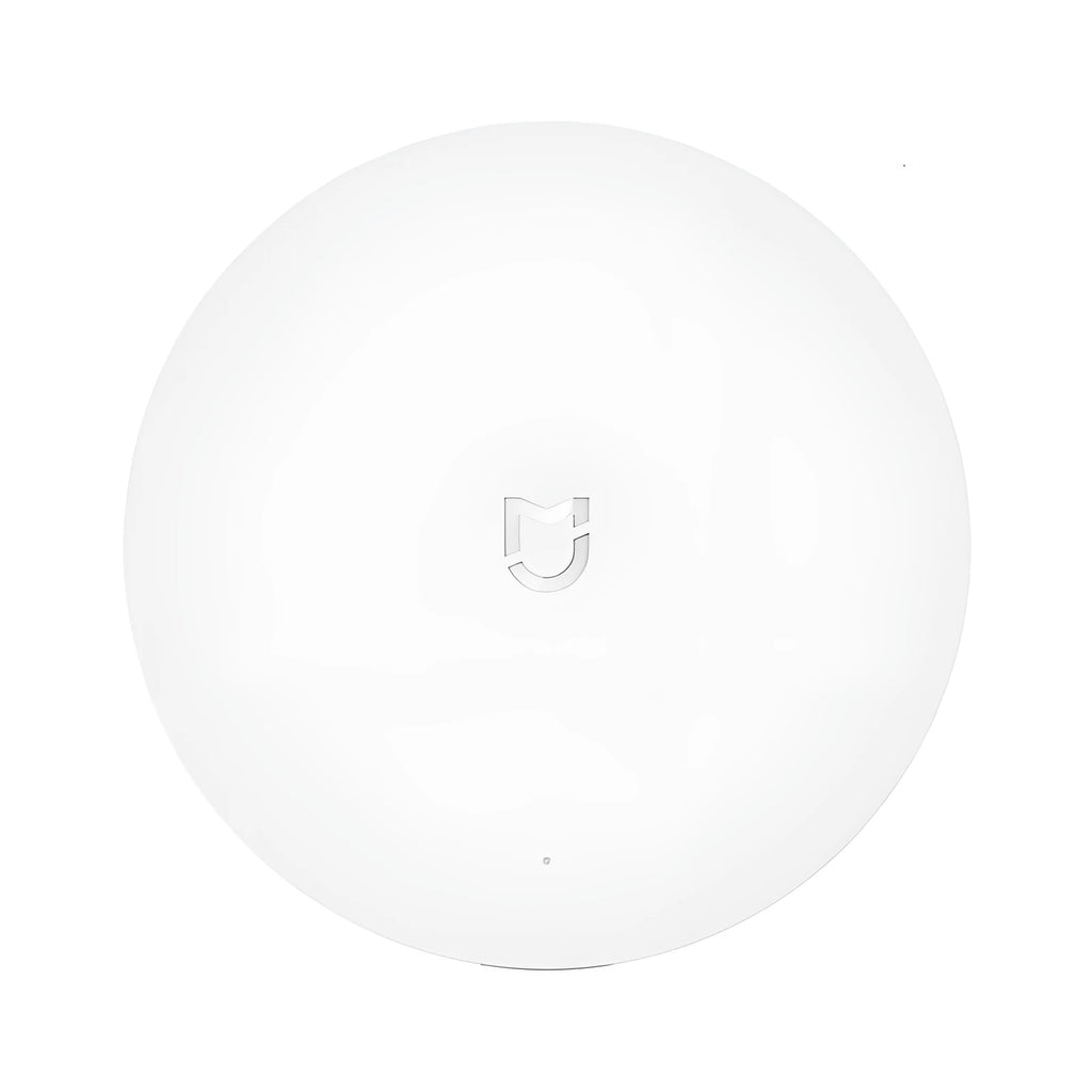 White circular Xiaomijia smart home gateway with UK plug for wireless remote control
