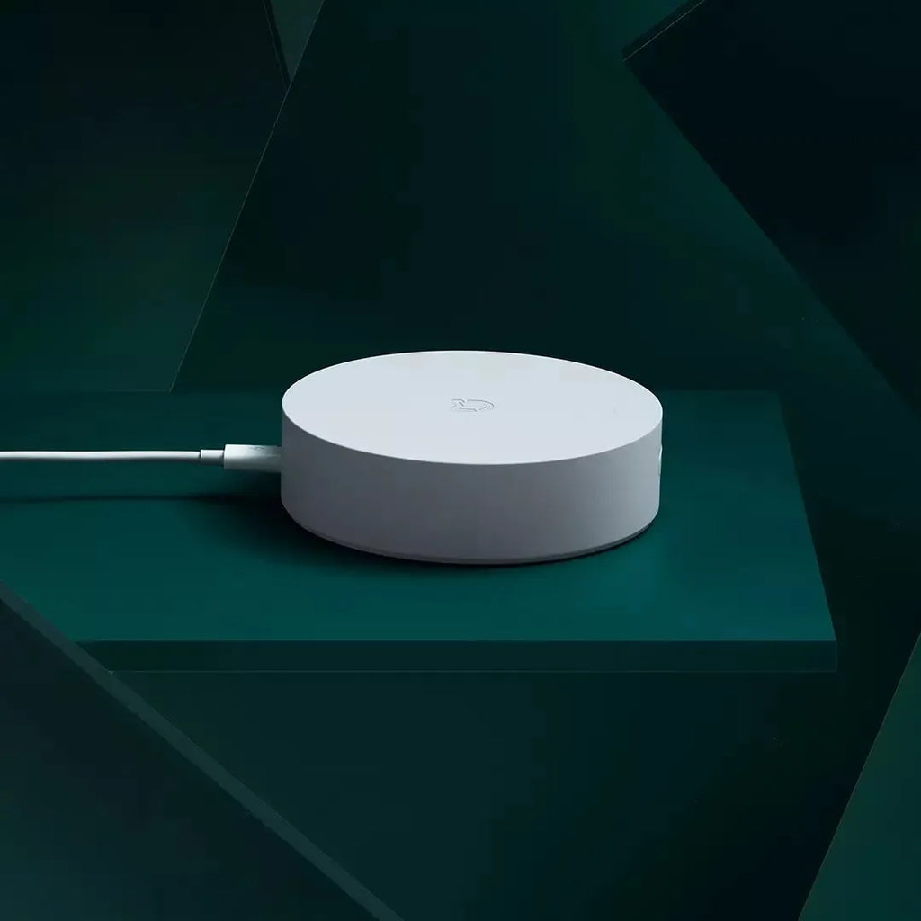 White circular Xiaomijia smart home gateway with UK plug for wireless remote control