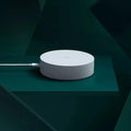 White circular Xiaomijia smart home gateway with UK plug for wireless remote control