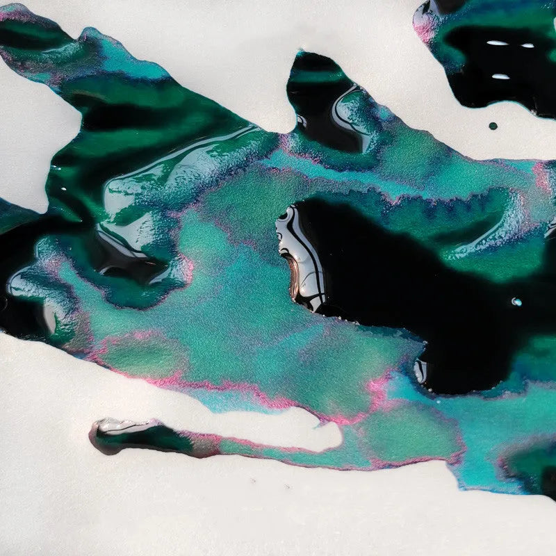 Bottle of strong sheen gradient fountain pen ink with gold powder in Red Tide or Truffle colour.