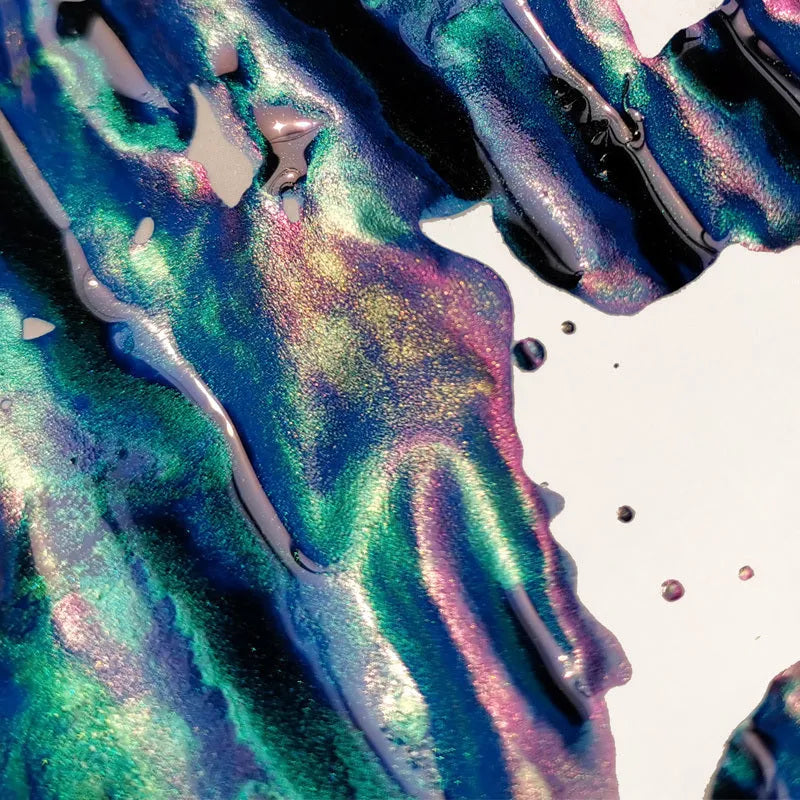 Bottle of strong sheen gradient fountain pen ink with gold powder in Red Tide or Truffle colour.