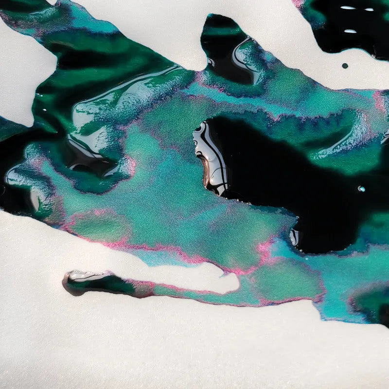 Bottle of strong sheen gradient fountain pen ink with gold powder in Red Tide or Truffle colour.