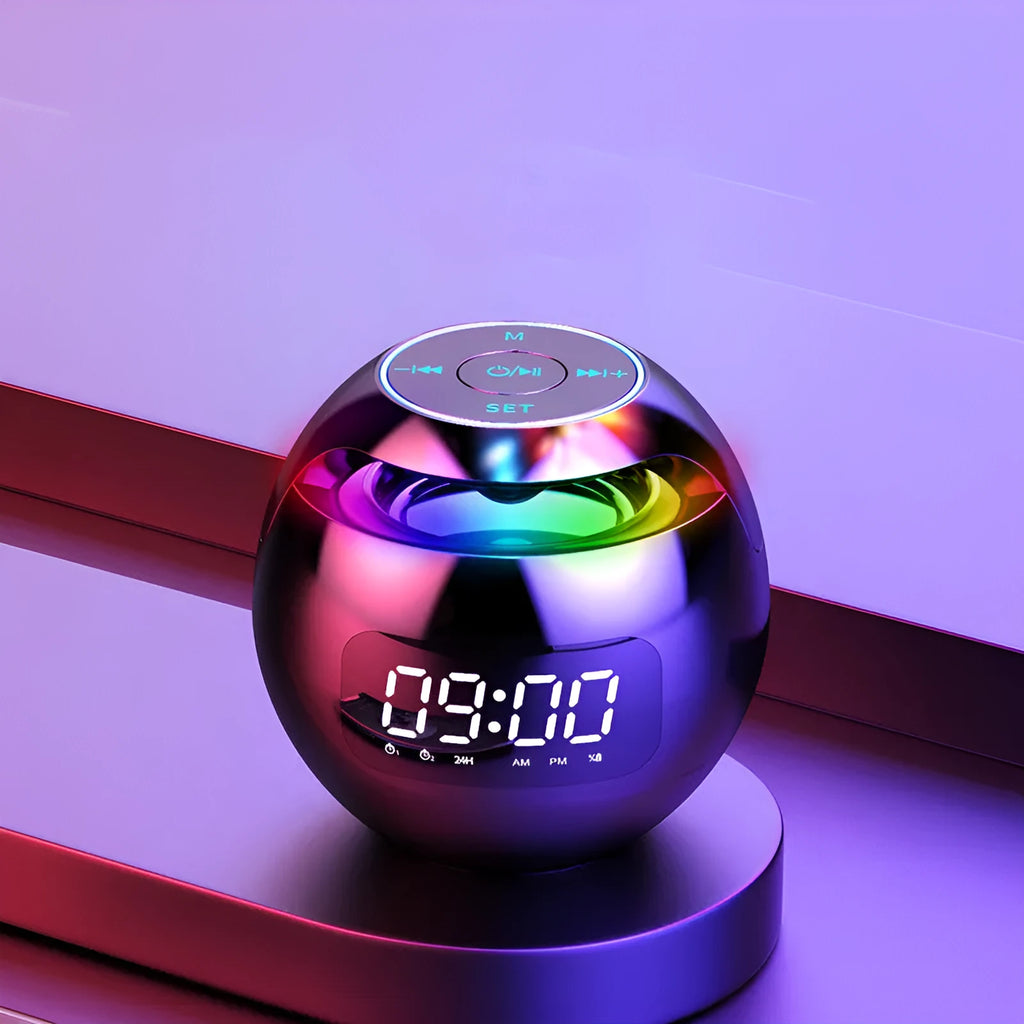 Mini ball Bluetooth speaker in pink with colourful lights and clock display on plastic casing