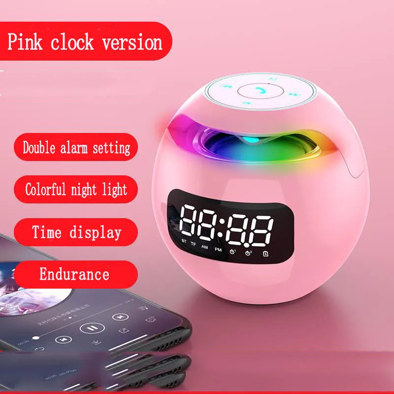 Mini ball Bluetooth speaker in pink with colourful lights and clock display on plastic casing