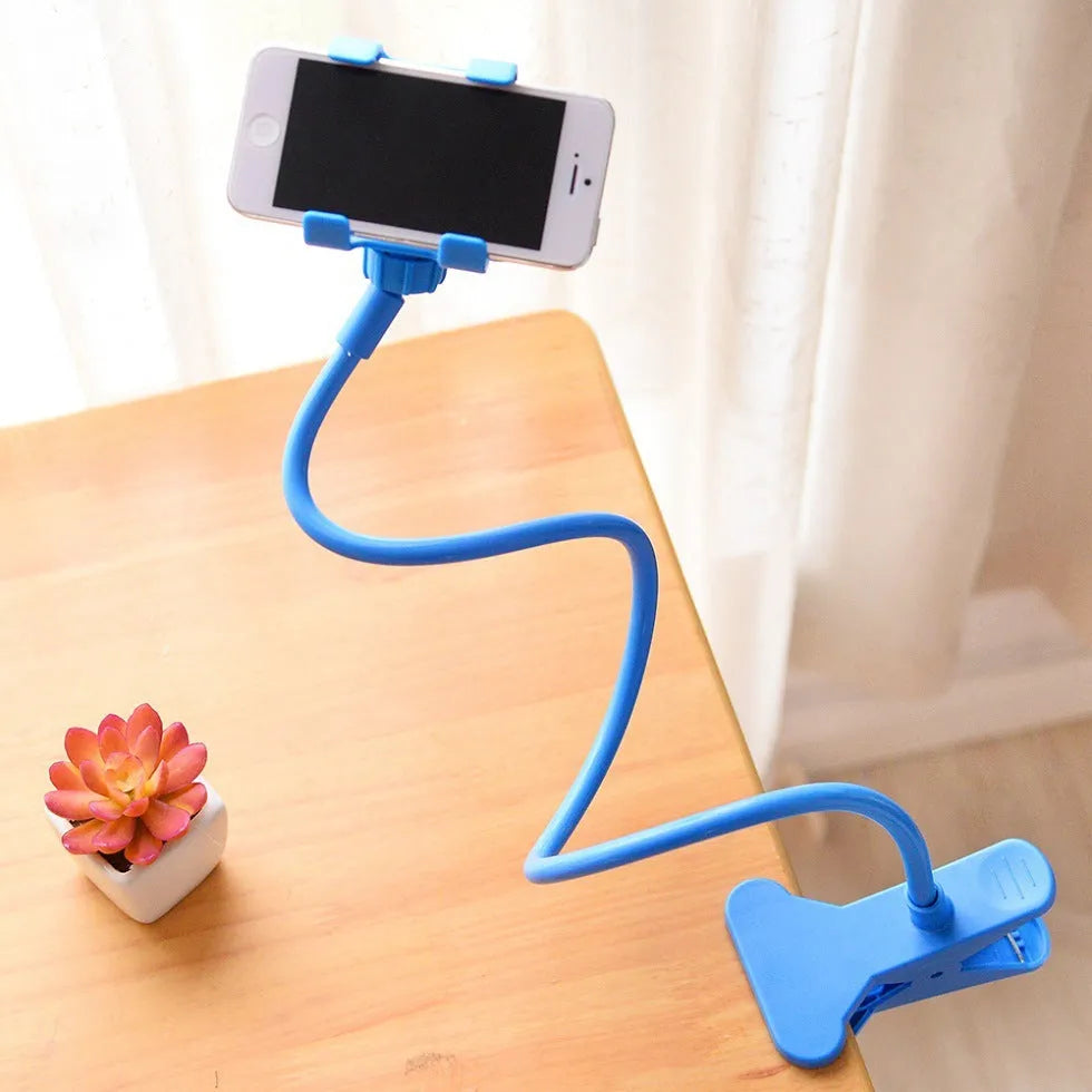 Black flexible long-arm phone holder with V-clip mounted on bed frame showing adjustable angles