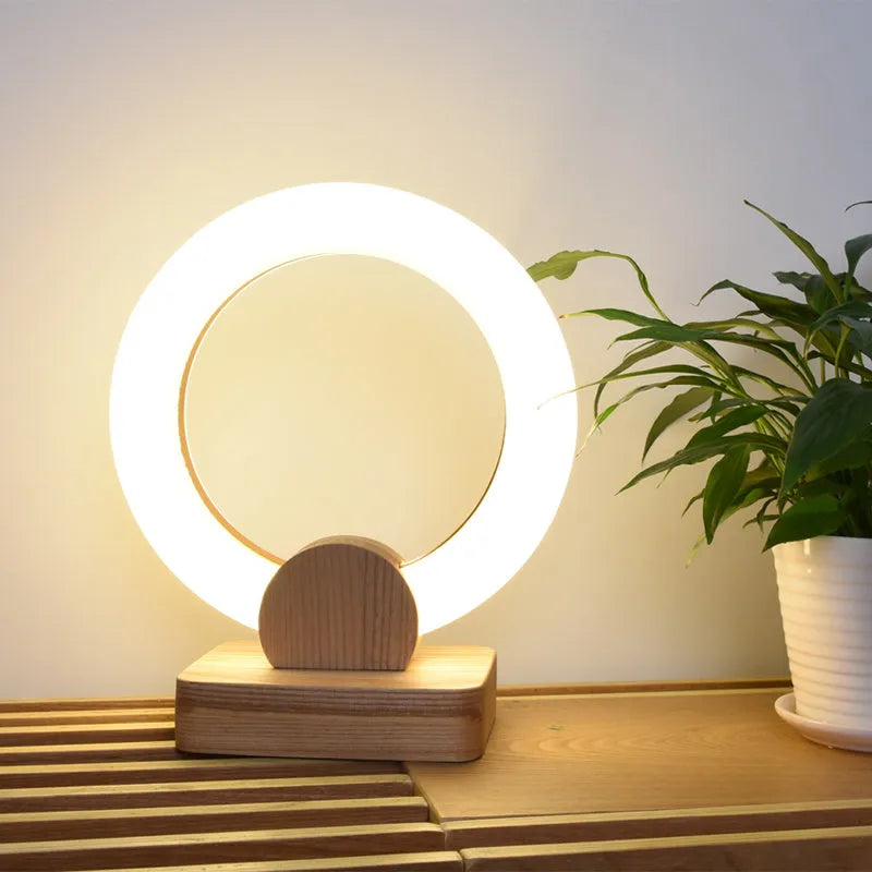 Round wooden art chandelier with acrylic shade hanging in a living room, available in 20cm and 30cm sizes.
