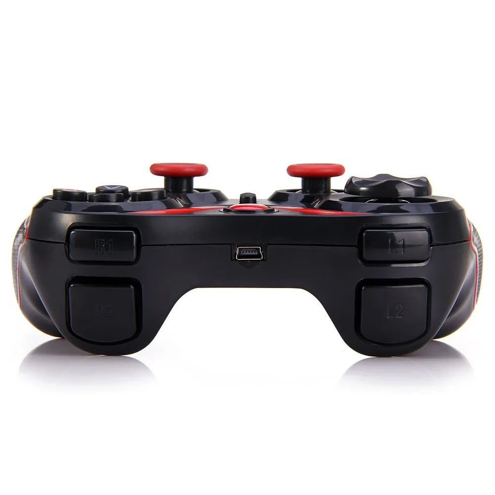 Black wireless Bluetooth gamepad controller for Android and iOS mobile phones on a table.