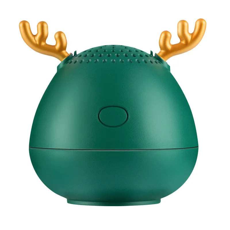 Small rectangular portable Bluetooth speaker in green, pink, or white with USB charging cable.