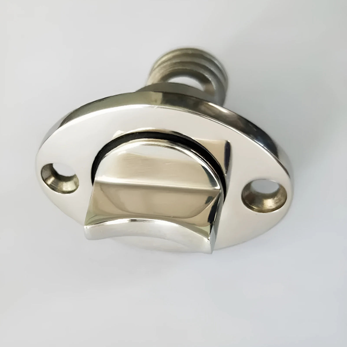 Stainless steel marine deck water plug with brass screw, shown next to a ruler for scale.