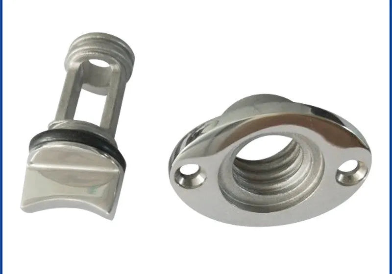 Stainless steel marine deck water plug with brass screw, shown next to a ruler for scale.
