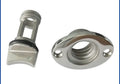 Stainless steel marine deck water plug with brass screw, shown next to a ruler for scale.